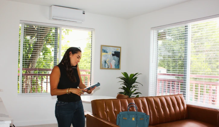 A woman standing in a room, considering loan options in Florida